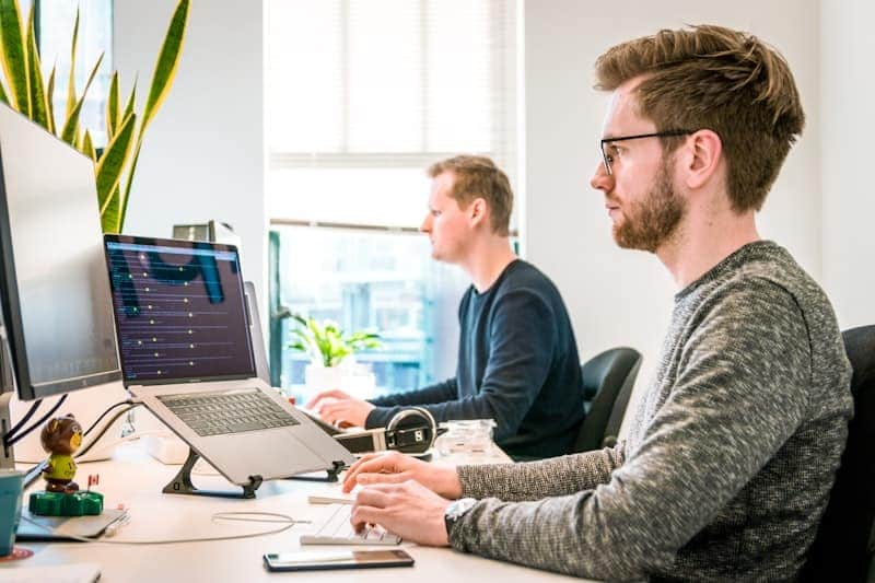 IT support team working at helpdesk stations