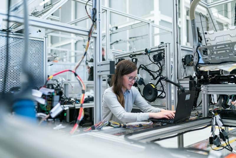 IoT device engineer working on circuit board components